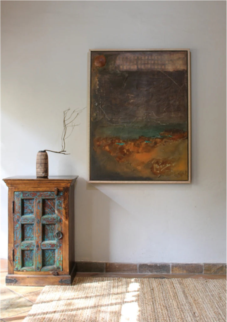An abstracted landscape through a rich palette of deep browns and earthy rust tones. Layers of rough, weathered texture and faint geometric patterns near the top hint at ancient markings or architectural traces. The overall composition feels both grounded and atmospheric, capturing a sense of erosion