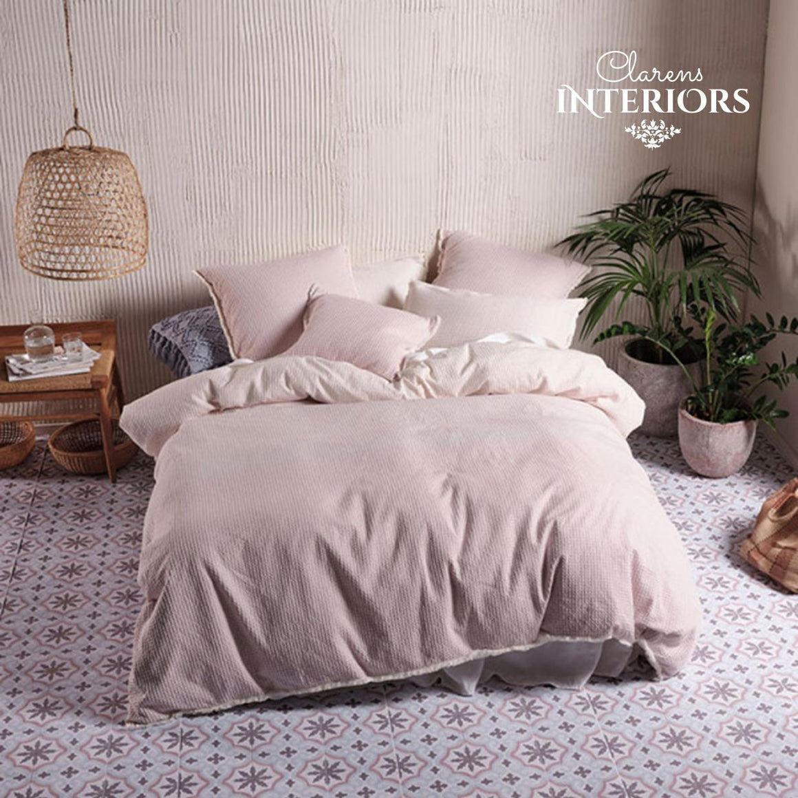 Lucca Blossom duvet cover set. Reminiscent of a coastal romance, Lucca enjoys a softly toned ombre in graduating hues of warm white and blossom pink on a beautifully woven and textured waffle ground. This cotton beauty is trimmed with fringing and reverses to a plain-dyed cotton.